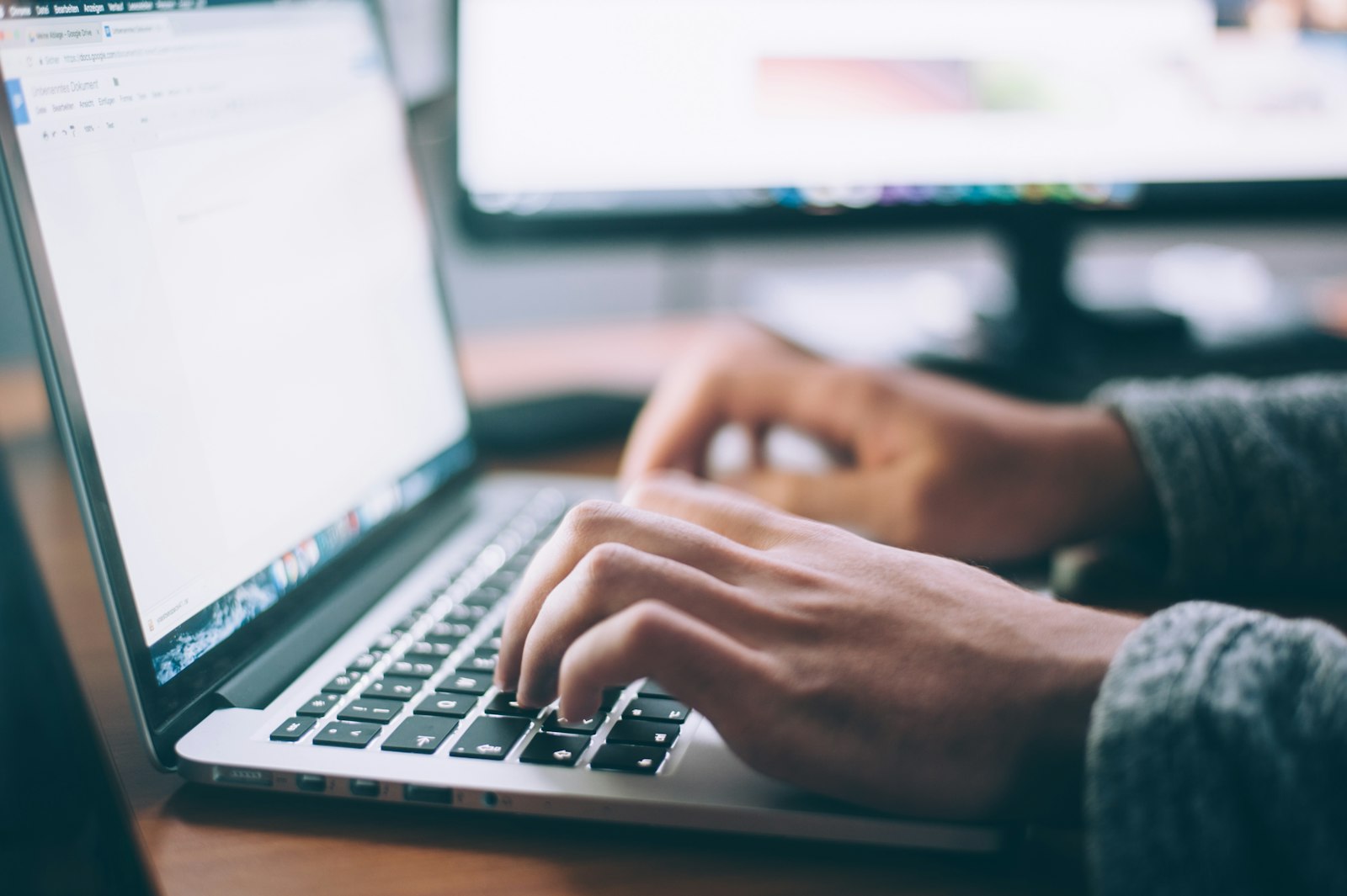 Photograph of a laptop on a desk